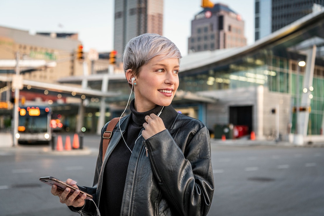 Klipsch wired headphones woman in a city music consumption